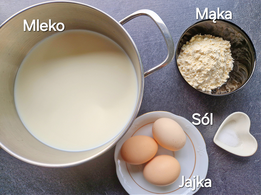 kładniki do przygotowania szwołków: mleko, mąka, sól i jajka na ciemnym blacie.
